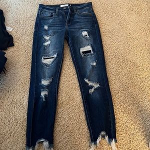 skinny jeans, ripped, some rips w: patched underneath